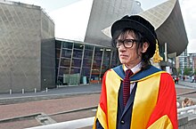 Clarke receives an honorary doctorate from the University of Salford, 2013.