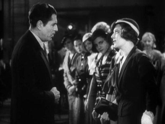 Tough stage director Julian Marsh (Warner Baxter) and the naive newcomer chorus girl, Peggy Sawyer (Ruby Keeler).