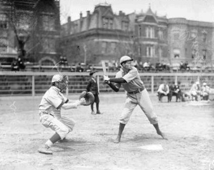 A Knox baseball player at bat in a 1908 game versus DePaul University