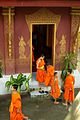 Laos - Luang Prabang 71 - young monks leaving their evening prayer at Wat Sensoukharam (6582298499).jpg