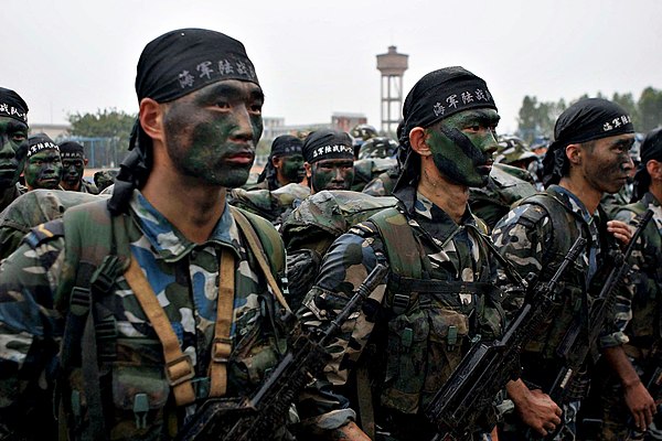 PLA marines based in Zhanjiang stand at attention during a visit by a U.S. admiral in 2006.