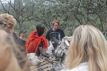 Masai guide showing animal skeleton.jpg