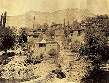tinted photo of a hillside village