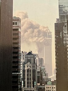 The Twin Towers burning from the impact of two airplanes, specifically American Airlines Flight 11 and United Airlines Flight 175. Michael's Grandfather's 9-11-2001 Photo.jpg