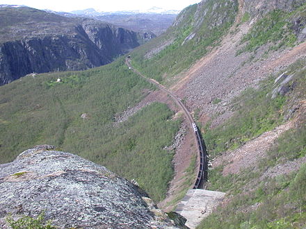 Iron ore train through the wild Narvik mountains near the border to Sweden