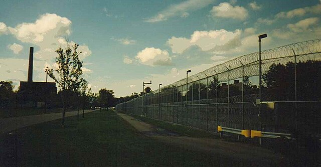 Partial view of Gowanda Correctional Facility with power plant in background at left, September 1996