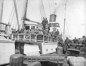 Passengers aboard the steamer Roanoke leaving for the Klondike from a Seattle dock, June, 1898 (SEATTLE 2679).jpg