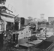 Wreckage of Downes after being hit by bombs during the attack on Pearl Harbor, December 7, 1941 Photograph of the wreckage of the USS Downes, hit by bombs during the attack on Pearl Harbor - NARA - 306547 - cropped.png