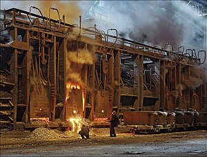 Open hearth furnace workers in Ukraine taking a steel sample, c. 2012 Prace na martinske peci.jpg