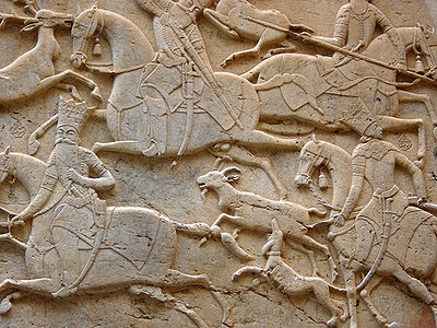 A Persian mid-relief (mezzo-rilievo)  from the Qajar era, at Tangeh Savashi in Iran, which might also be described as two stages of low relief This is a rock relief carved into a cliff.