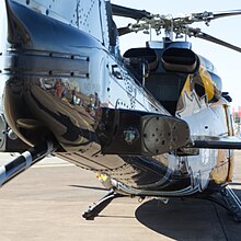 Bell 412CF looking forward from the tail, showing its twin turbine engine exhausts RCAF Bell CH-146 5D3 4156 (43790685721).jpg