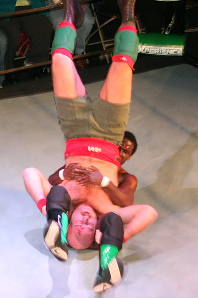 Swann performing a piledriver on Jake Manning