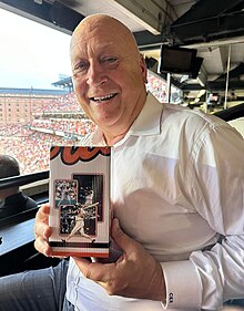 Ripken posing with a figurine