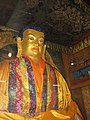 Shakyamuni Buddha in the prayer hall, Nyanang Phelgye Ling Monastery.jpg