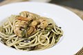 Spaghetti with agretti and shrimps