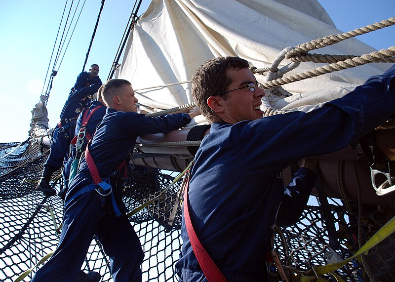 File:US Navy 070801-N-2385B-001 Working on USS Constitution's bowsprit, Seaman Apprentice Andrew Lewis (right) and Seaman Bob Griffiths work with other Sailors at setting and furling the jib.jpg