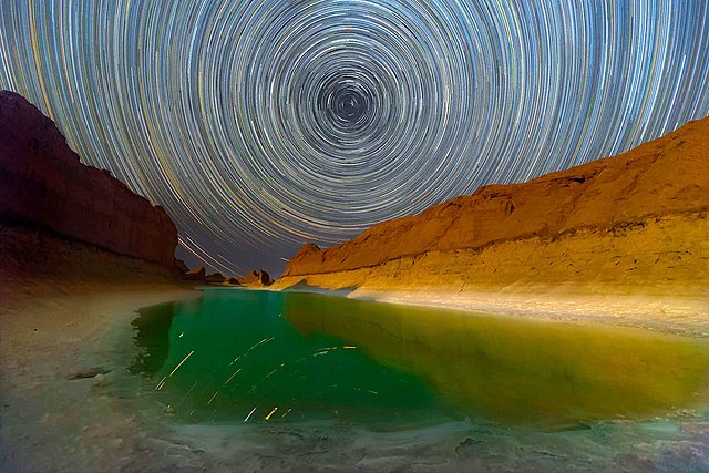 Star trail photography on salt lake in Lut desert in Iran