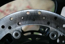 A drilled motorcycle brake disc 2009-02-10 2008 Yamaha FZ6 front rotor close-up.jpg