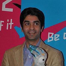 Abhinav Bindra, former air rifle shooter, won a gold medal in the 10m air rifle shooting event at the 2008 Beijing Olympics. Abhinav Bindra and Mary Kom - British High Commission, Delhi, 27 July 2011 (cropped).jpg