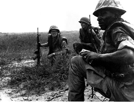 USAF Security Police from Tan Son Nhut Air Base watch for Viet Cong infiltration attempts along the base perimeter during the Vietnam war