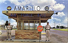 Base gate and checkpoint at the since-closed Amarillo AFB. Life inside of military bases differs significantly from the civilian world, giving many military brats a feeling of difference from civilian culture. Amarillo Air Force Base - Front Gate - Postcard.jpg