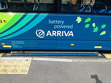 An Arriva Shires & Essex Wright StreetLite EV bus whilst using induction to recharge its batteries at a bus stop. ArrivaTheShires-WrightStreetLiteEV-WolvertonAgora-P1340897.JPG