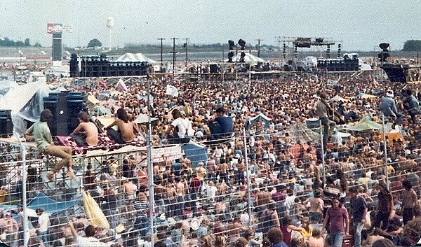 A crowd of people at the August Jam in 1974. The concert gained a reputation for its violence, becoming "Carolina's Woodstock".