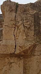 A male figure playing aulos. Southern theatre at Jerash.