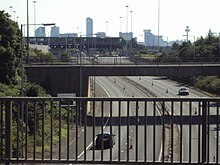 The Wallasey entrance to the Kingsway Tunnel. Liverpool's skyline is visible in the background. Benkid77 Kingsway Tunnel Approach Road 2 090809.JPG