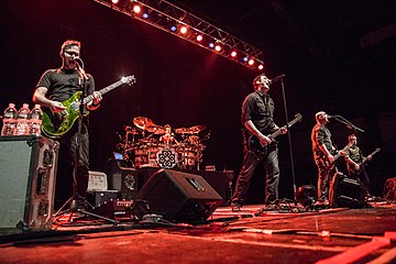 Breaking Benjamin performing in 2015. From left to right, Keith Wallen, Shaun Foist, Benjamin Burnley, Aaron Bruch, and Jasen Rauch.