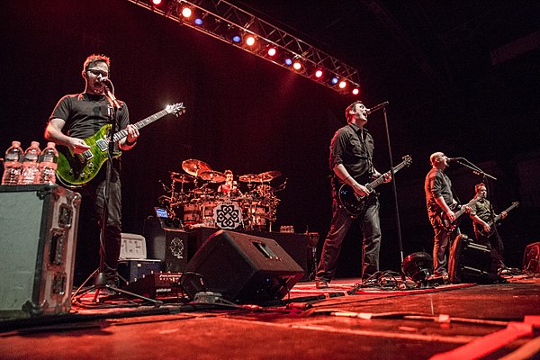 Breaking Benjamin performing in 2015. From left to right, Keith Wallen, Shaun Foist, Benjamin Burnley, Aaron Bruch, and Jasen Rauch.