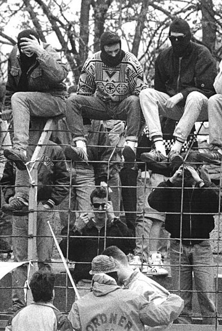 Hooligans of FC Berlin with masked faces in a match between FC Carl Zeiss Jena and FC Berlin in April 1990.