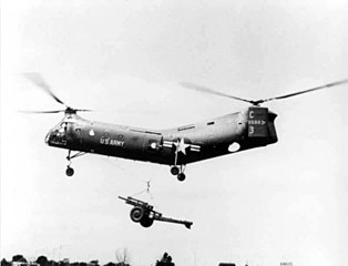 CH-21C with 105mm howitzer as a slung load