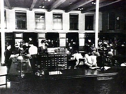 One of the first open shelf libraries: Pittsburgh's South Side branch, about the time it opened in 1910 and had a massive front desk
