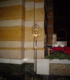 Tintinnabulum, a small bell signifying the status of the church as a minor basilica
