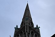 The building is described as "particularly idiosyncratic" by Cherry and Pevsner.[7] Bronze lion and bull at the base of the spire