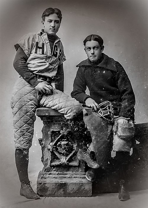 Charles Ives, left, captain of the baseball team and pitcher for Hopkins Grammar School, aged 18 (c. 1893)