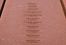 Portion of the corten steel monument at the EJI's National Memorial for Peace and Justice memorializing the Black individuals lynched in Dallas County, Alabama. Dallas County AL EJI Memorial.jpg