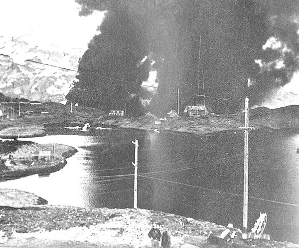 The Navy radio station at Dutch Harbor burning after the Japanese attack, June 4, 1942