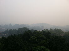 The effects of the haze on Singapore. Normally, the hills in the background can be clearly seen. Effects of 2013 Southeast Asian haze on Singapore.jpg