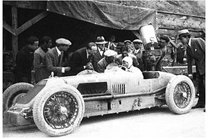Materassi in his Talbot, refuelling at the Italian GP Emilio Materassi on Talbot Darracq 700.jpg