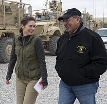Burnett in December 2012, interviewing U.S. Secretary of Defense Leon Panetta in Afghanistan Erin Burnett interviewing Leon Panetta in Afghanistan Dec 13, 2012 crop.jpg
