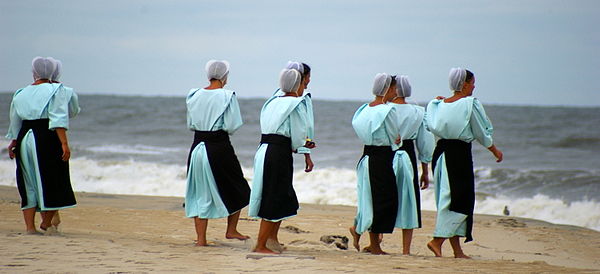 Amish young women at the beach, Chincoteague, Virginia.