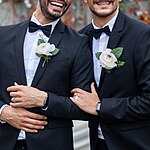 Same-sex marriage has been linked with increases in life expectancy compared to unmarried same-sex couples. Gay couple wedding faceless.jpg