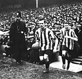 Captain George Utley leads Sheffield United out for the 1915 FA Cup final George utley sheffield to field 1915.jpg