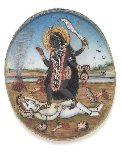 Dakshina Kali, with Shiva devotedly at her foot.