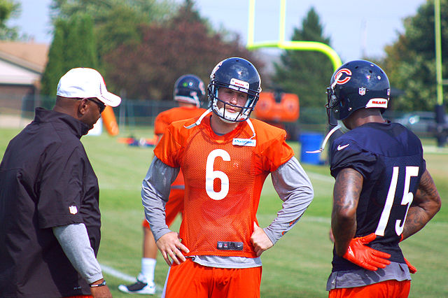 Marshall (right) talking with Bears quarterback and teammate Jay Cutler during training camp.