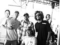 Kelly Slater with surfers and fans.jpg