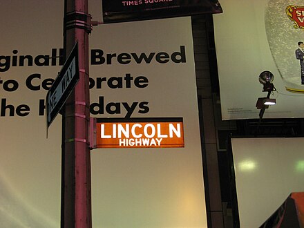 Sign marking the Eastern Terminus of the Lincoln Highway at the intersection of 42nd Street and Broadway in Times Square, New York.