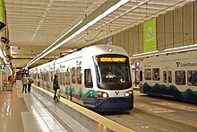 1 Line light rail trains in the Downtown Seattle Transit Tunnel at the University Street Station Link trains at University St station in 2010.jpg